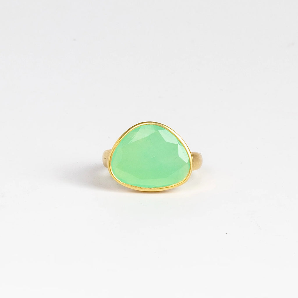 The Chrysoprase Greek Ring by Pippa Small Jewellery is an organically shaped, and hand cut, bright green, faceted and translucent chrysoprase set in 18k yellow gold. Size 6.5 in stock.