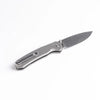 Pyrite Button Lock Titanium Knife on white background.