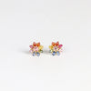 Rainbow Daisy studs (pair) by Polly Wales on white background.