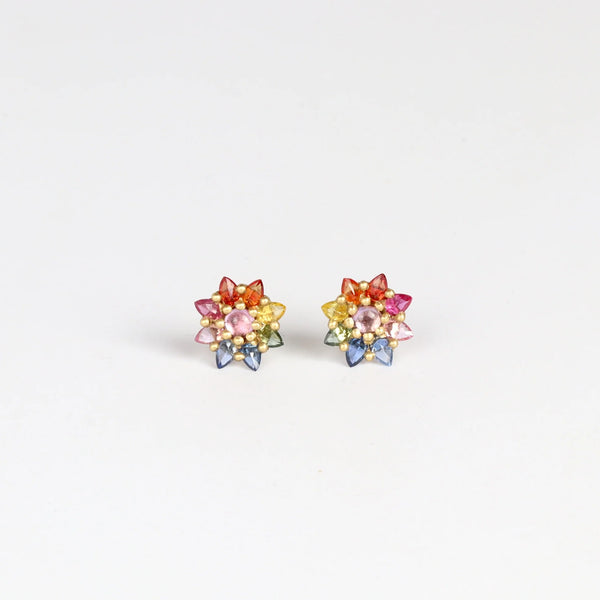 Rainbow Daisy studs (pair) by Polly Wales on white background.