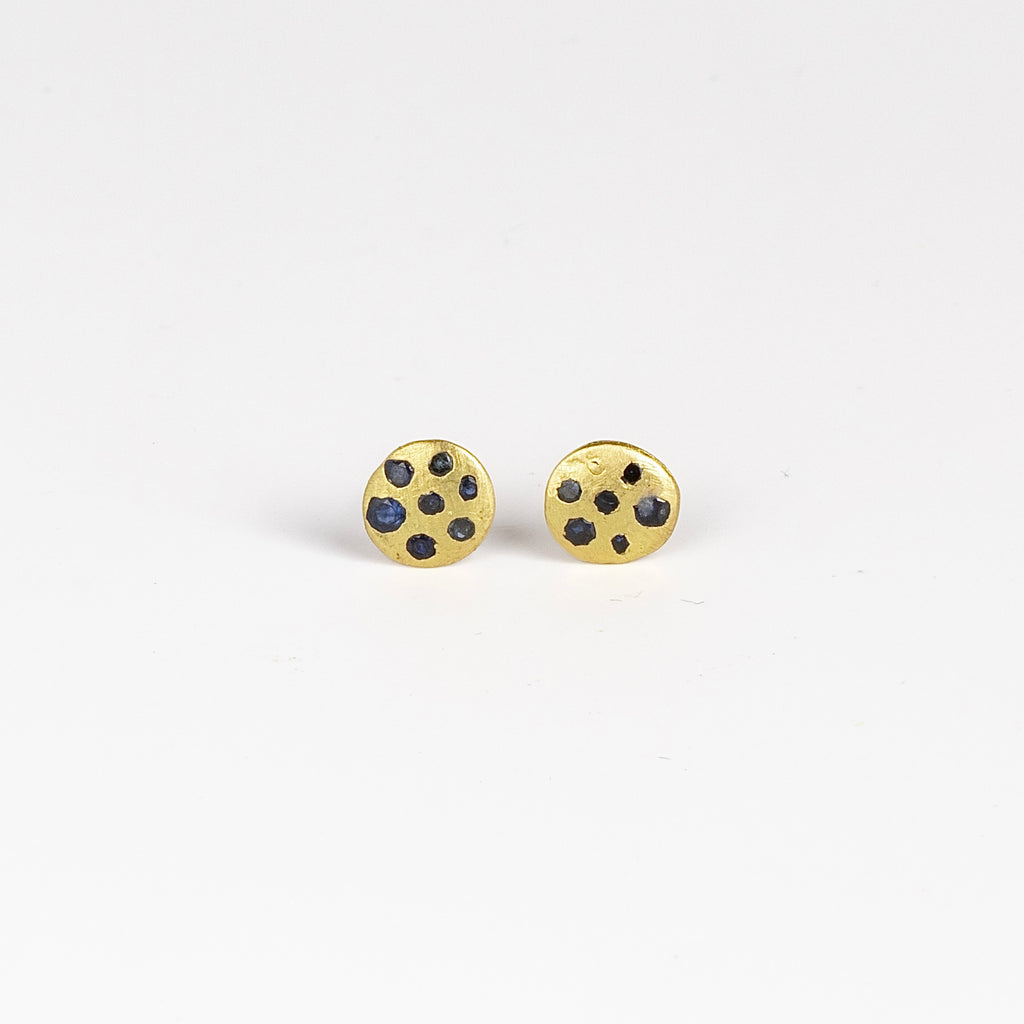 Polly Wales XS XSmall extra small Confetti Celeste Disc Stud Earrings in mid blue to navy Sapphires are classic, 18k recycled yellow gold disc earrings with blue in various shades sapphires, cast not set, cast in place and made in Los Angeles.