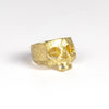 Side view of perfect 18k yellow gold snaggle tooth skull ring by Polly Wales.