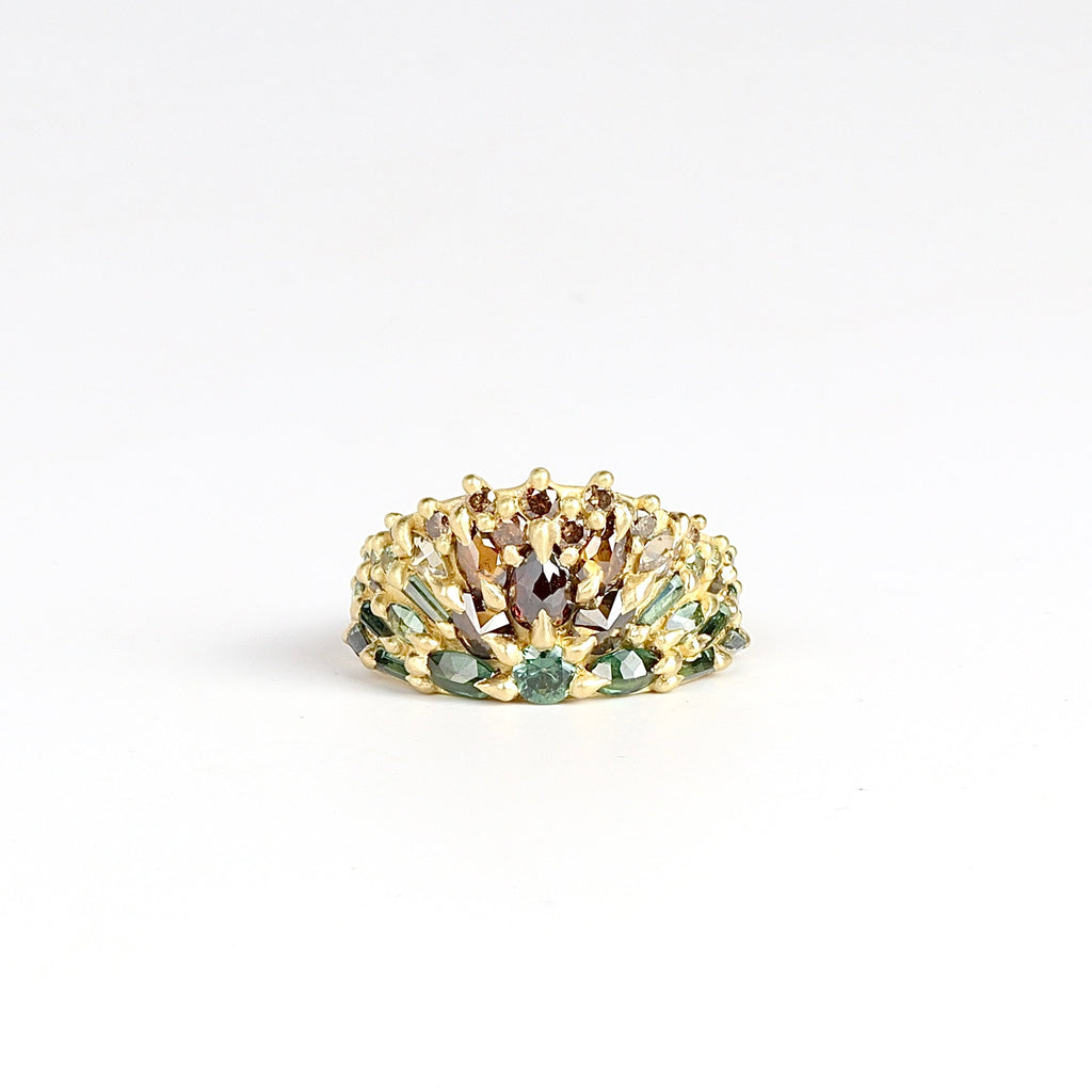 Mossy Bog Uber Encrusted Neli Half Shield ring is a mixed cut sapphires in green and white, cognac and champagne diamonds in an OK exclusive and one of a kind color way called "Mossy Bog" layered and encrusted into an 18k gold band. Cast Not Set. Handmade in Los Angeles. 