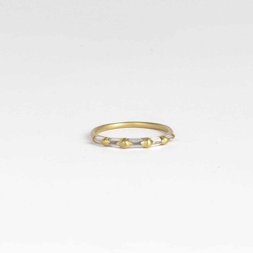 Lexi Diamond band ring by Polly Wales is a  halo band with five tapered baguette diamonds&nbsp;(.33tcw). Cast in Place. Cast not set.