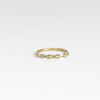 Lexi Diamond band ring by Polly Wales is a  halo band with five tapered baguette diamonds&nbsp;(.33tcw). Cast in Place. Cast not set.