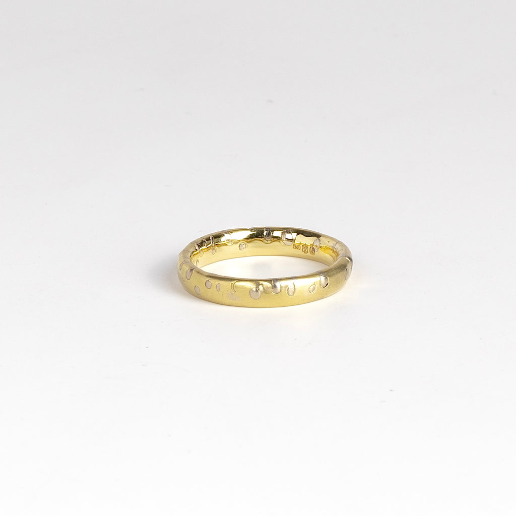 Narrow Grain Ring by Polly Wales is an 18k yellow gold band with grains of yellow gold speckled through out -reminiscent of the classic confetti band. Cast not set. Handmade in Los Angeles. Size 9.5