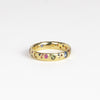 Rainbow Confetti Ring Band by Polly Wales is a narrow 18k gold band with speckled mixed sapphires around the circumference for a beautiful confetti-like appearance. Recycled gold. Cast not set. Handcrafted in Los Angeles.