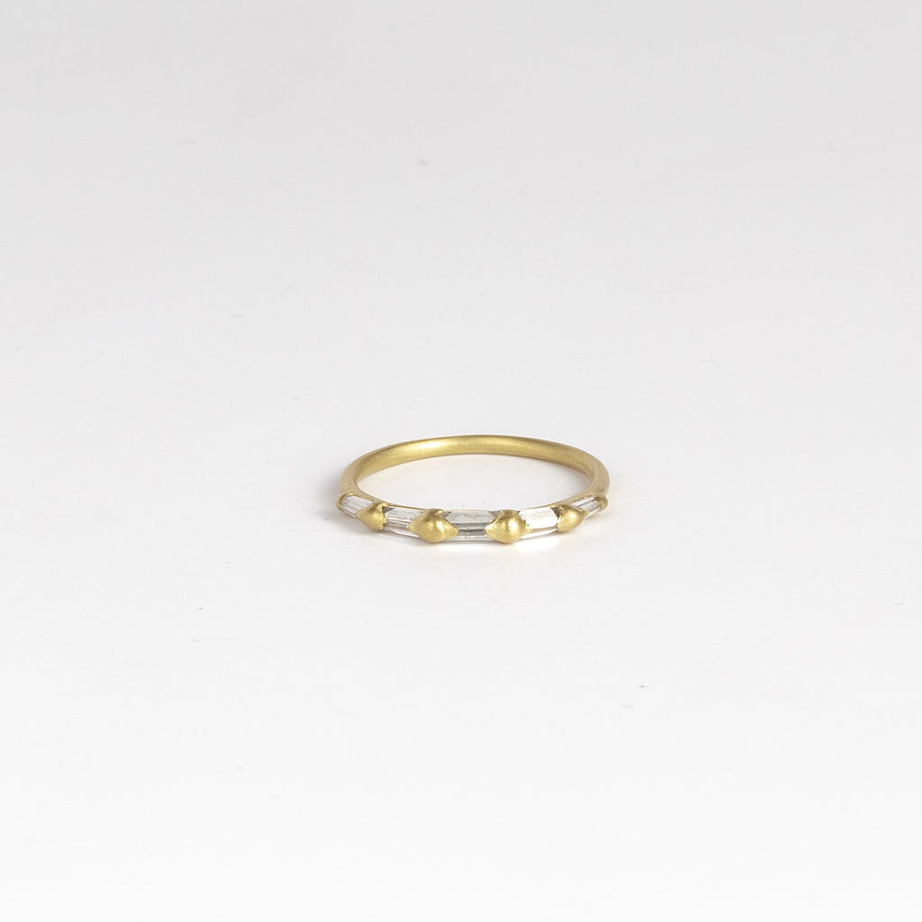 Lexi Diamond band ring by Polly Wales is a  halo band with five tapered baguette diamonds&nbsp;(.33tcw). Cast in Place. Cast not set.