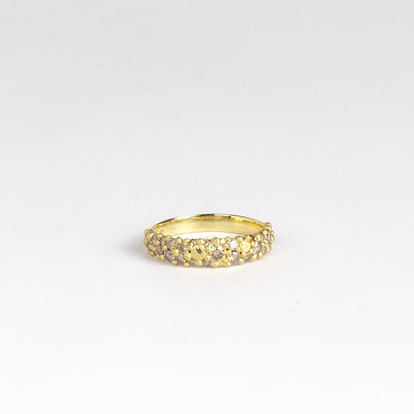 River Ring - Cognac Diamond by Polly Wales is a narrow scale pinched band in 18k recycled yellow gold encrusted with champagne to cognac diamonds. Cast in Place. Cast not set. Handcrafted in Los Angeles.