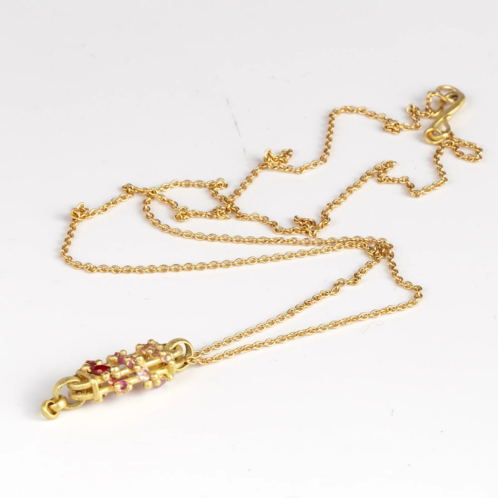 Vertical Fontaine Bar Necklace in Plum Blossom by Polly Wales on white background.