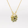 Green Fantaisie Encrusted Padlock Necklace by Polly Wales is a padlock in 18K yellow gold and encrusted with mixed green sapphires, a center cabochon and an accent diamond hanging on a chain that attaches to the lock handle by pulling the lever. Recycled gold. Cast in Place. Cast not set. Handmade in Los Angeles.