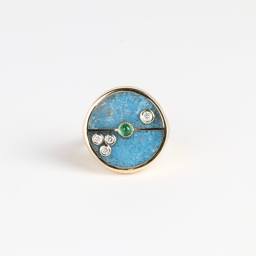 The Compass Signet Ring in Trolleite and Emerald from Retrouvai is a unique modern take on an heirloom signet ring. Stone inlay is accented with a center gem stone and white diamonds. Handcrafted in Los Angeles. Size 6.5 in stock.
