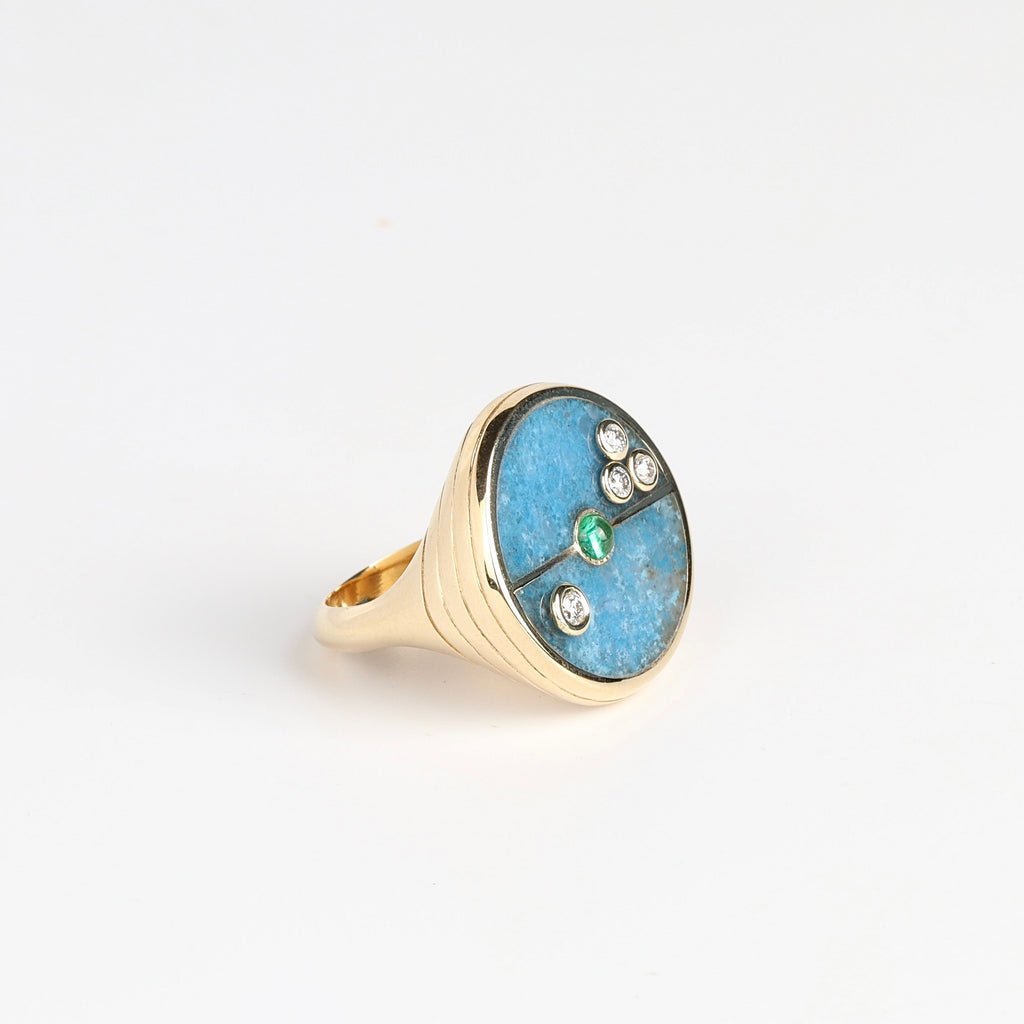 Alternate angle of The Compass Signet Ring in blue Trolleite and Emerald  center stone with accent diamonds from Retrouvaimin size  6.5