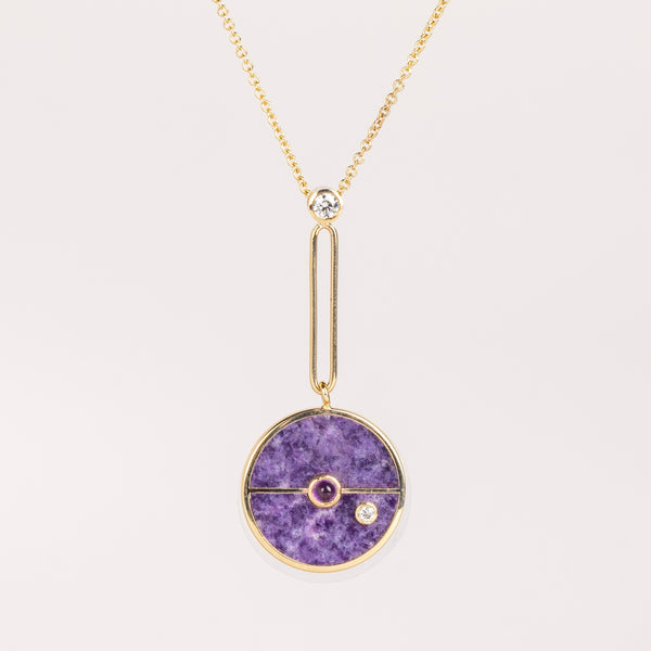 The Signature Compass Pendant in Lepidolite and Amethyst from Retrouvai is a unique modern take on an heirloom pendant. Stone inlay is accented with a center gem stone and white diamond. The compass hangs from an elongated paperclip link accented with a second white diamond. Handcrafted in Los Angeles.