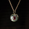 Moss Agate with Red Tourmaline Lollipop Necklace by Retrouvai. 