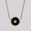 Mini Compass Pendant Necklace in Black Onyx by Retrouvai with round white diamond accent on 16" 14k yellow gold chain.