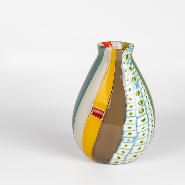 Robin Mix Medium Flat Cane Murrini Vase with Windows 7" is a flat cane vase with Murrini and windows by Robin Mix. His sensibilities come from his training in Scandinavia, but is produced using the most sophisticated and iconic of traditional modernist Italian techniques