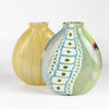 Small Flat Cane Vase with Murrini and windows in front of a flat tobacco cane "onion skin" vase. Both are mouth or hand blown by Robin Mix for Studio Glass in Tunebridge, Vermont.