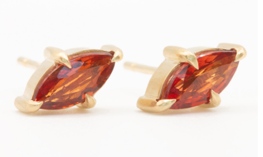 Orange sapphire studs on white 