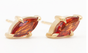 Orange sapphire studs on white 
