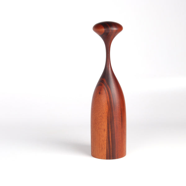 Serratus Pepper Mill Grinder designed by Tantalus in Goncalo Alves on white background.