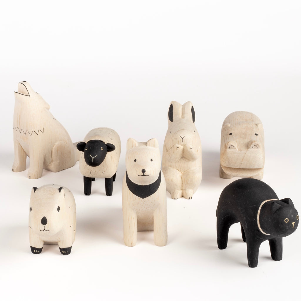 T-lab wooden animals are handmade in Bali from albizia wood, a lightweight fast-growing wood from the South Pacific. A dog, black cat, speckled sheep, a capybara, rabbit, howling wolf and hippo and cow.