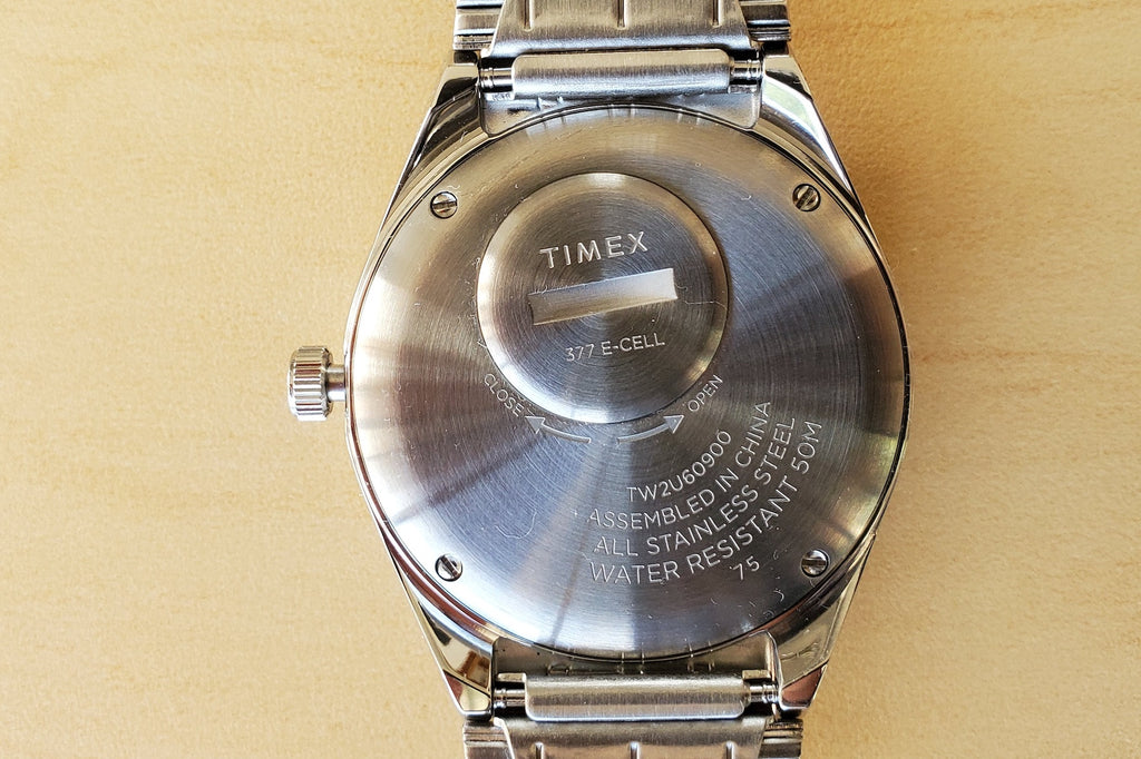 Timex Q Reissue Diver Watch in 38mm with black dial or blue dial and black and red or black bezel and silver stainless steel bracelet.