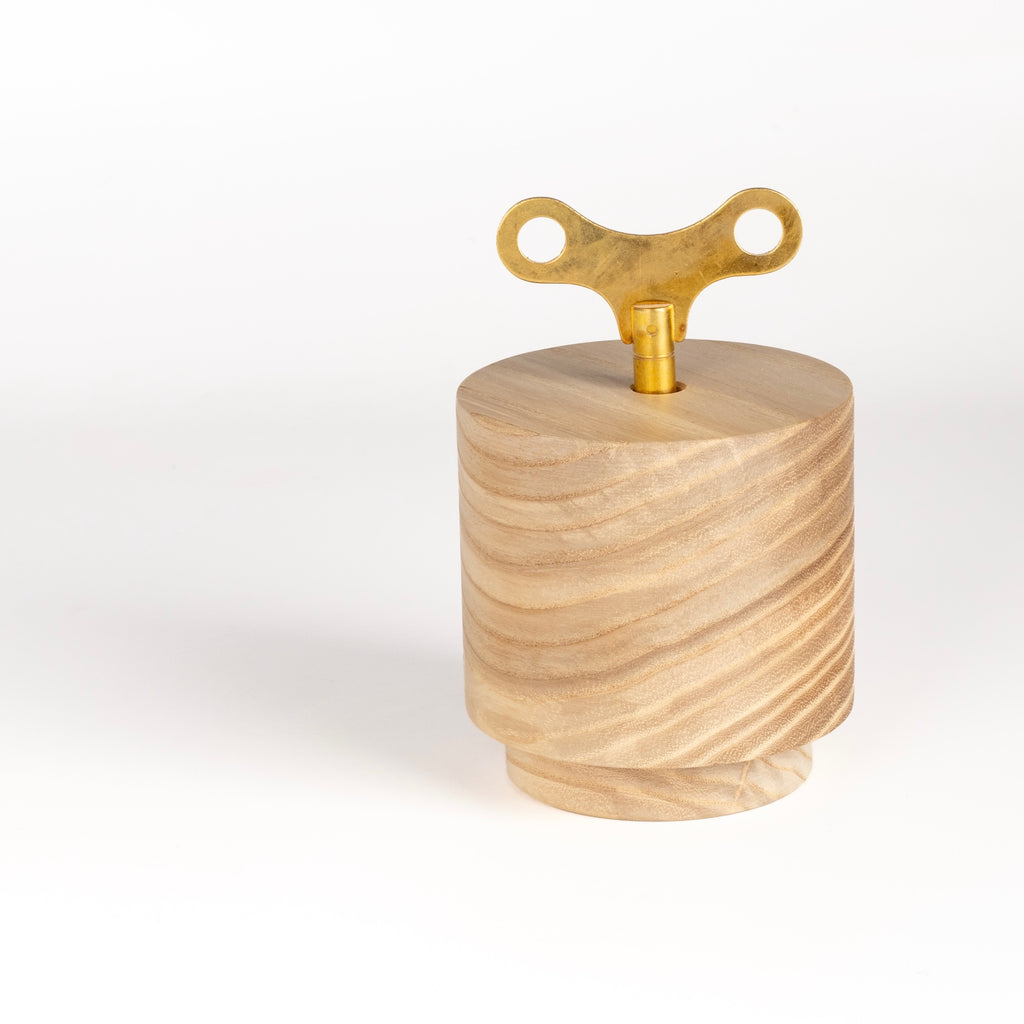 A wind up music box imade by a family run business in the Black Forest, Germany. A mechanical 18-note chime mechanism is inserted into solid wood, carved into this shape. It continually plays a 2 minute excerpt from "Waltz of the Flowers" and the Nutcracker Suite by Tchaikovsky.