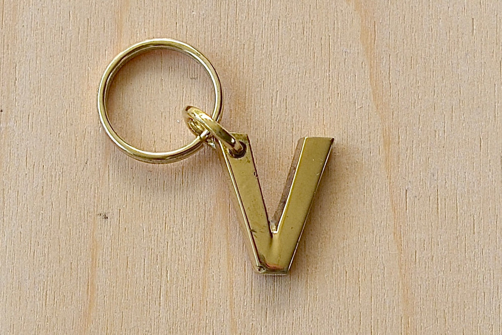 'V' Letter keyring, key chain, key ring in brass made by Carl Aubock. 