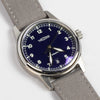 38mm Automatic Issue Field Watch with Blue Dial and Date and Gray Canvas band on white background.
