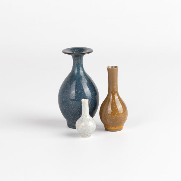 Miniature Hand Thrown Ceramic Vase Trio in Spotted Blue, Brown and Moonstone White are three tiny and hand thrown ceramic vases hand thrown by Japanese born, UK based potter Yuta Segawa