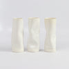 Distorted and all white medium Yuta Segawa Cylinder vases.