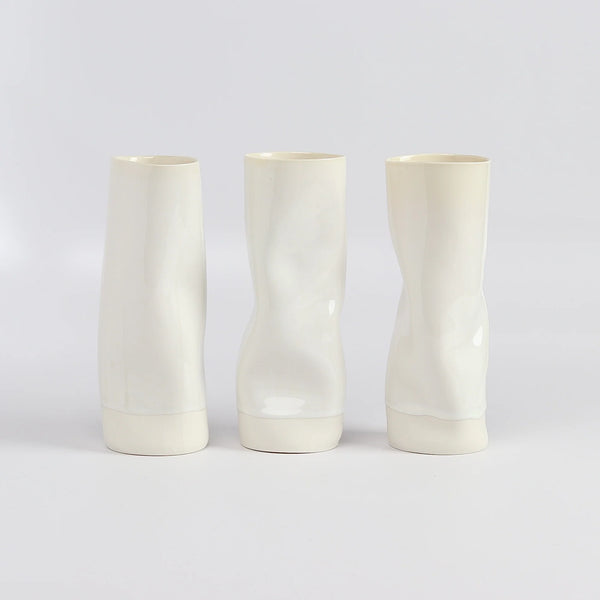Distorted and all white medium Yuta Segawa Cylinder vases.