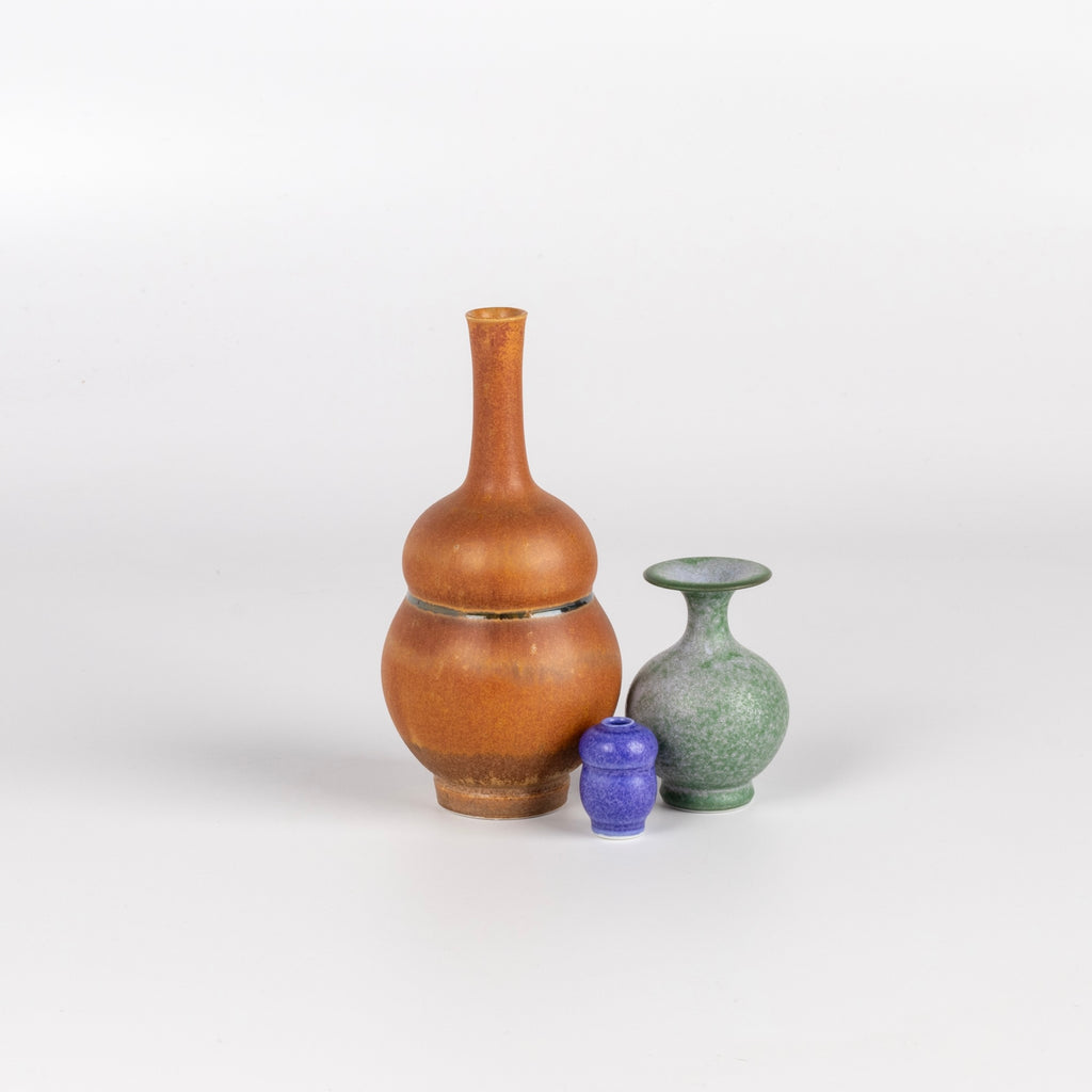 Miniature Hand Thrown Ceramic Vase Trio by Yuta Segawa in Brown, Green and Purple on white background.