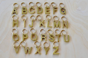 Full set of brass letter keyrings, key rings, key chains in brass by Carl Aubock.