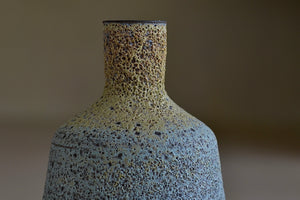 Detail of Heather Rosenman taller Short Blue with Yellow Volcanic Vase.