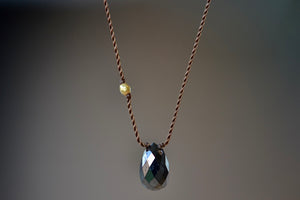 Close up of Black Diamond and 18K Bead Pendant Necklace designed by Margaret Solow.