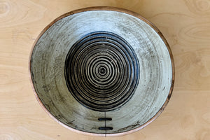 Inside of Circle Factory black and white bowl.