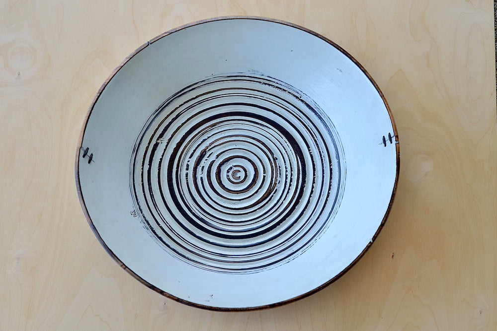 Inside view of Circle Factory turned wood bowl in black and white with ridged grooves and stitch detailing by George Peterson.