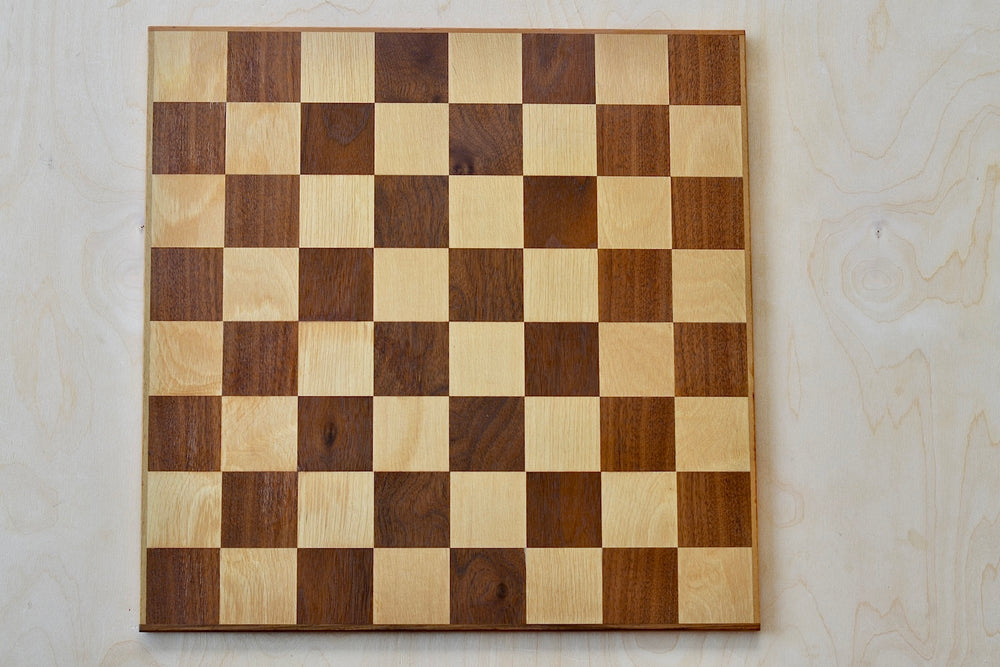 Solid wood chess board in walnut and maple.