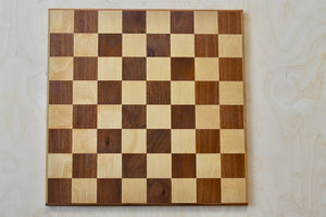 Solid wood chess board in walnut and maple.