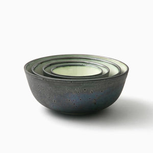 Set of bowls by One Kiln on white background.