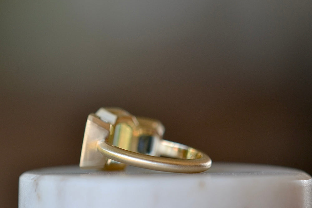 Band and side view of Emerald trio ring.