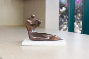 Sculpture in bronze of Modern Seated Woman by Anne Ricketts.