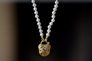 Small Seed Pearl Strand in White by Polly Wales with Polly Harlequin padlock.