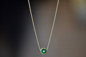 Mini Compass Pendant Necklace in Green Malachite by Retrouvai with round white diamond accent on 16" 14k yellow gold chain.