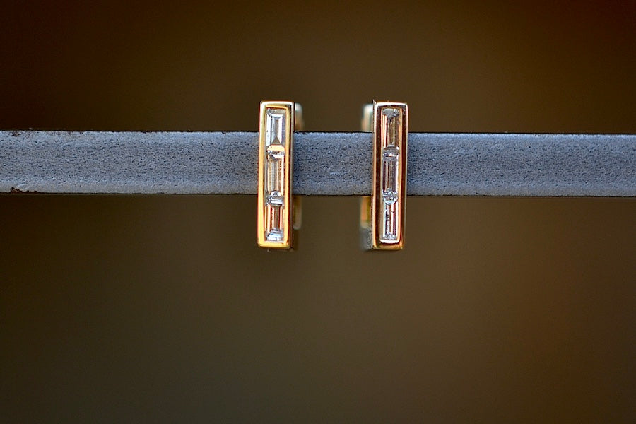 Petite Square Diamond Huggie Earrings by Lizzie Mandler are elegant day to night earrrings of a square huggie hoop with three white diamond baguettes and post and hinge closure in 18k gold. Sold as a pair.
