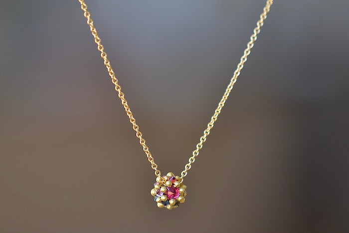 Polly Wales Small Sputnik Dome Pendant Necklace is a domed half sphere in 18k yellow gold with encrusted and inverted pink, blue and yellow sapphires around the circumference hangs on a beautiful chain. Cast Not Set. Recycled Gold.