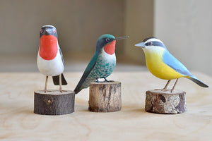 Our birds from Brazil are Beautifully made fair trade Birds from Brazil.  Modeled after birds from the region, this artisan makes them from reclaimed wood and supports his family by their production.