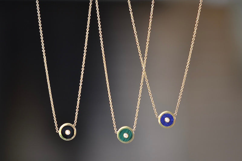 Mini Compass Pendant Necklace in Blue Lapis by Retrouvai with round white diamond accent on 16" 14k yellow gold chain with Black Onyx and Green Malachite..